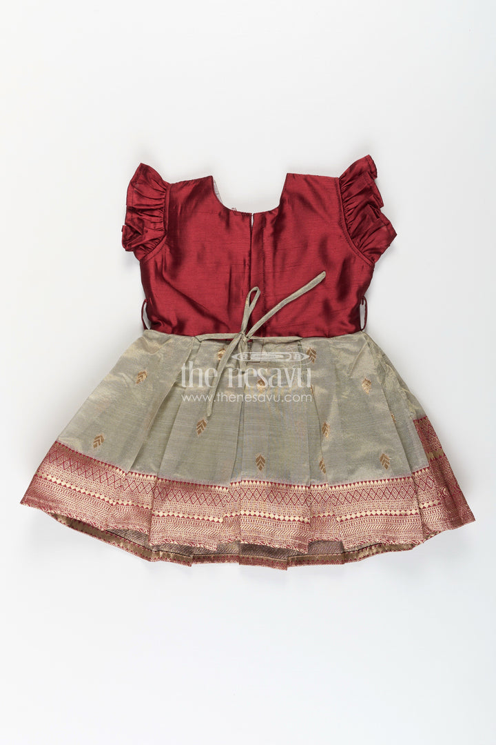 The Nesavu Silk Party Frock Girls Infant Baptism Dress in Maroon and Gold with Pleated Silk Skirt and Puff Sleeves for Graceful Looks Nesavu Girls Silk Infant Baptism Dress Zari Border Puff Sleeves Maroon Gold | The Nesavu