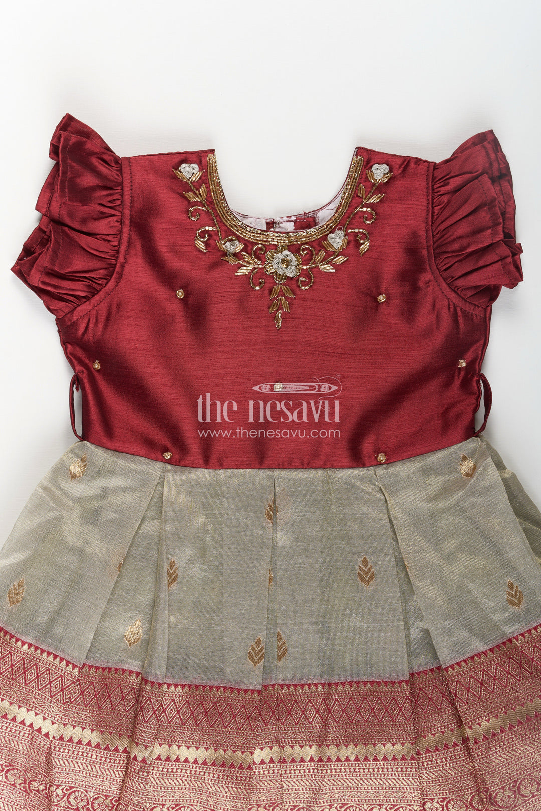 The Nesavu Silk Party Frock Girls Infant Baptism Dress in Maroon and Gold with Pleated Silk Skirt and Puff Sleeves for Graceful Looks Nesavu Girls Silk Infant Baptism Dress Zari Border Puff Sleeves Maroon Gold | The Nesavu
