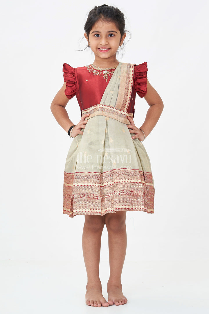 The Nesavu Silk Party Frock Girls Infant Baptism Dress in Maroon and Gold with Pleated Silk Skirt and Puff Sleeves for Graceful Looks Nesavu Girls Silk Infant Baptism Dress Zari Border Puff Sleeves Maroon Gold | The Nesavu
