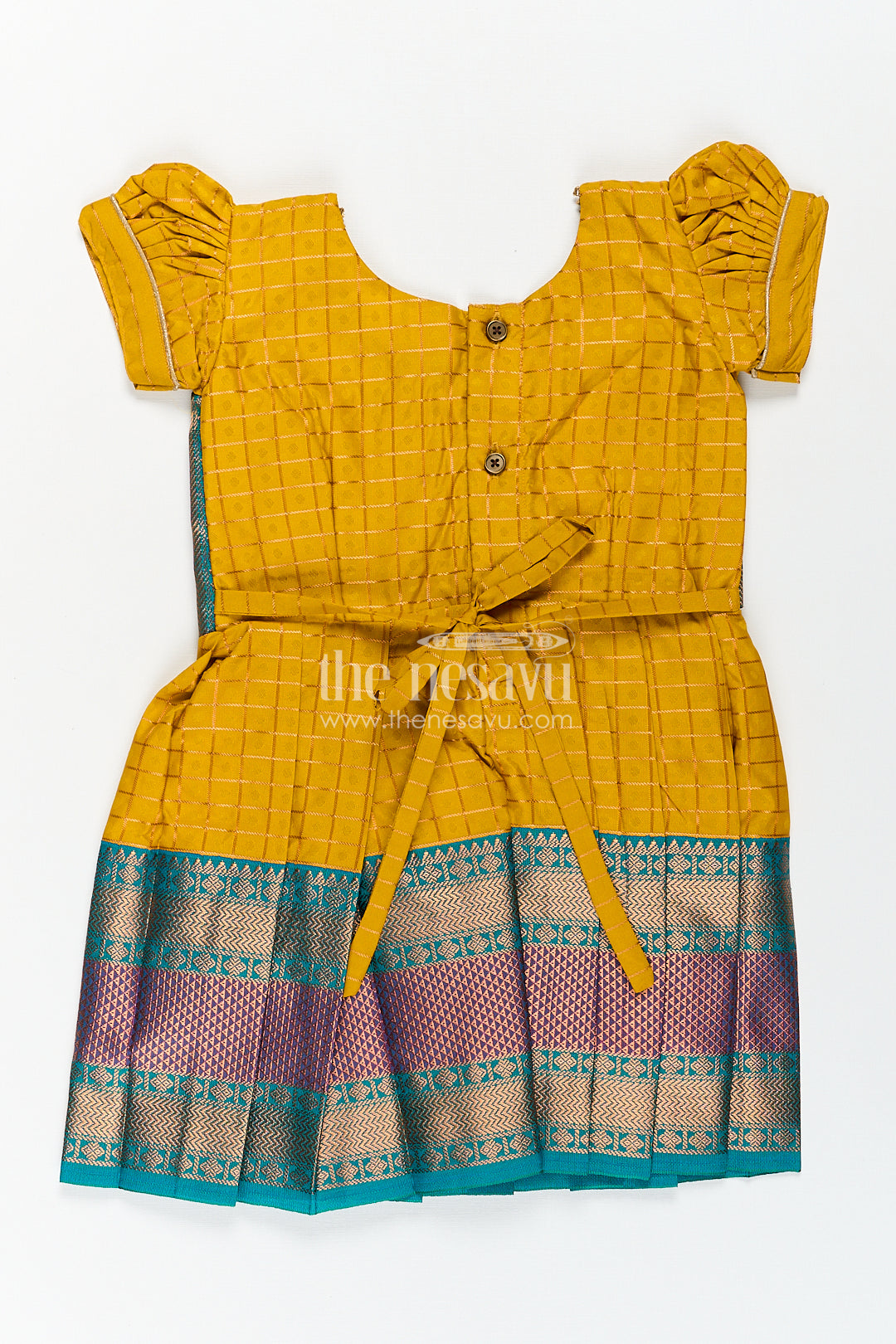 The Nesavu Girls Kanchi Silk Frock Girls Kanchivaram Ethnic Frocks in Mustard Yellow with Green Zari Overlay and Traditional Border Accents Nesavu Nesavu Girls Ethnic Frocks Mustard Green Kanchivaram Silk Zari Border Puff Sleeves