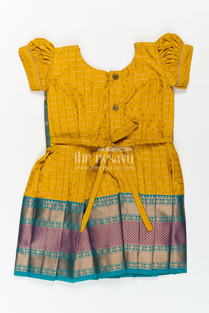 The Nesavu Girls Kanchi Silk Frock Girls Kanchivaram Ethnic Frocks in Mustard Yellow with Green Zari Overlay and Traditional Border Accents Nesavu Nesavu Girls Ethnic Frocks Mustard Green Kanchivaram Silk Zari Border Puff Sleeves