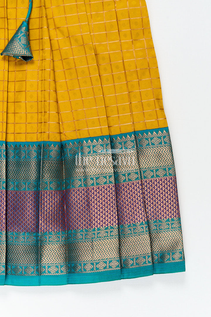 The Nesavu Girls Kanchi Silk Frock Girls Kanchivaram Ethnic Frocks in Mustard Yellow with Green Zari Overlay and Traditional Border Accents Nesavu Nesavu Girls Ethnic Frocks Mustard Green Kanchivaram Silk Zari Border Puff Sleeves