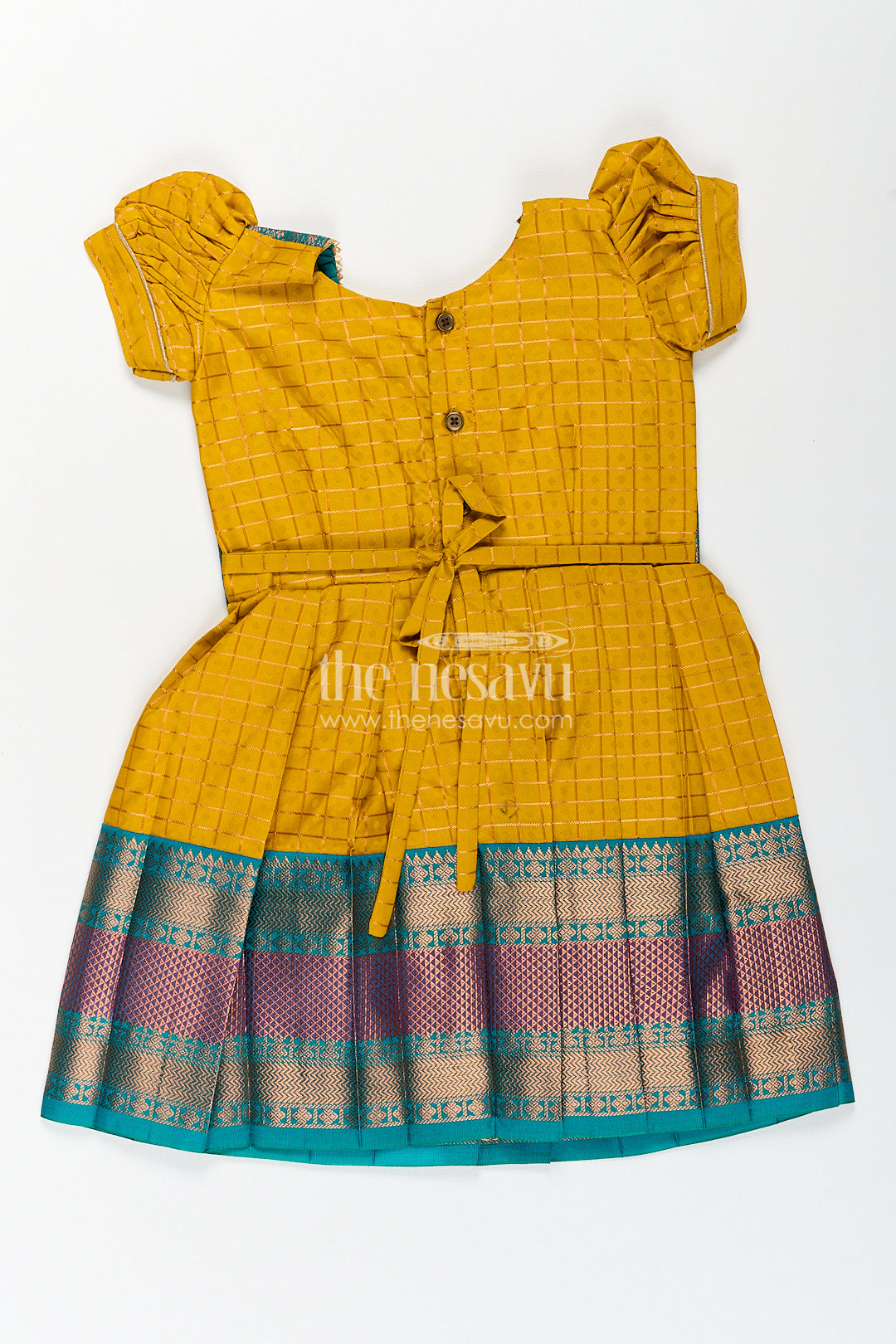 The Nesavu Girls Kanchi Silk Frock Girls Kanchivaram Ethnic Frocks in Mustard Yellow with Green Zari Overlay and Traditional Border Accents Nesavu Nesavu Girls Ethnic Frocks Mustard Green Kanchivaram Silk Zari Border Puff Sleeves