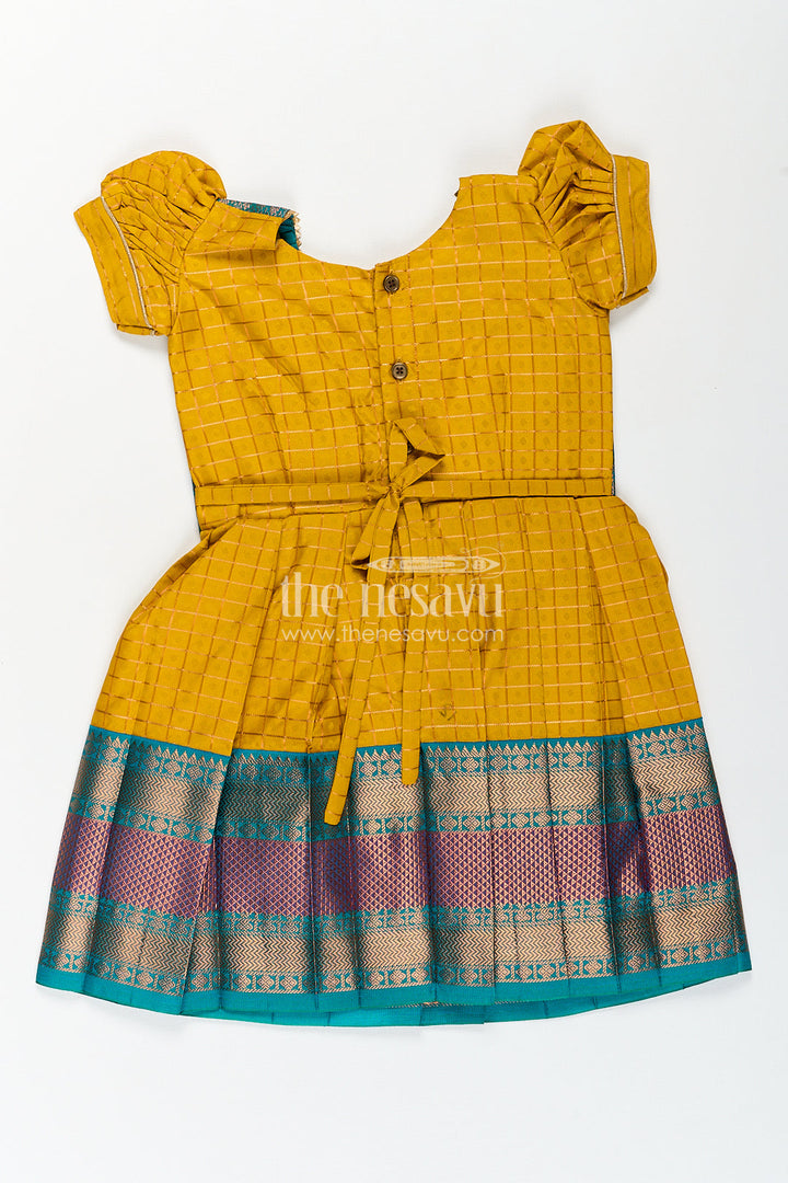The Nesavu Girls Kanchi Silk Frock Girls Kanchivaram Ethnic Frocks in Mustard Yellow with Green Zari Overlay and Traditional Border Accents Nesavu Nesavu Girls Ethnic Frocks Mustard Green Kanchivaram Silk Zari Border Puff Sleeves