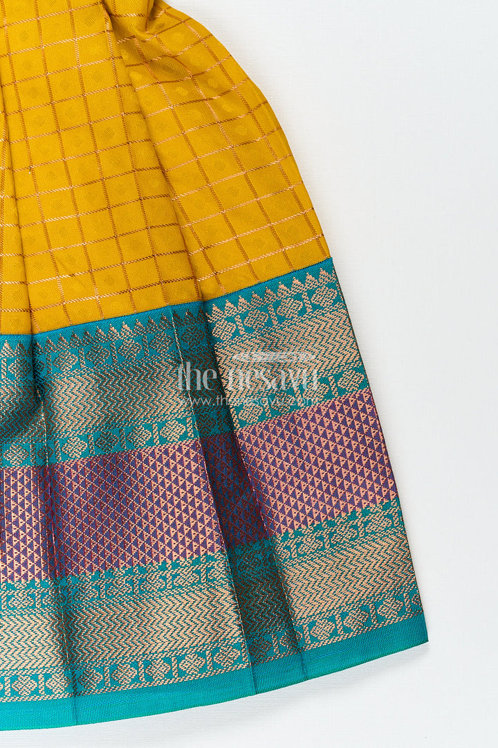 The Nesavu Girls Kanchi Silk Frock Girls Kanchivaram Ethnic Frocks in Mustard Yellow with Green Zari Overlay and Traditional Border Accents Nesavu Nesavu Girls Ethnic Frocks Mustard Green Kanchivaram Silk Zari Border Puff Sleeves