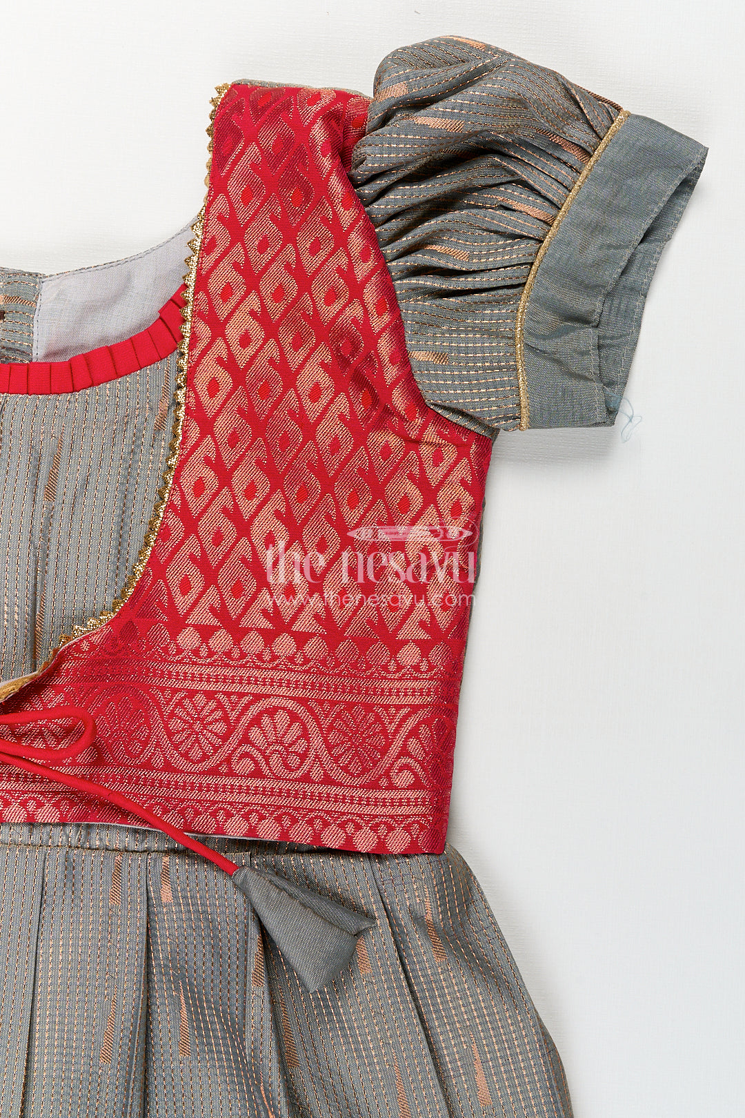 The Nesavu Girls Kanchi Silk Frock Girls Kanchivaram Long Pattu Frock with Puff Sleeves in Grey Silk and Rich Red Zari Border Finish Nesavu Nesavu Girls Long Pattu Frock Grey Kanchivaram Silk Red Zari Overlay Traditional Pleated Design