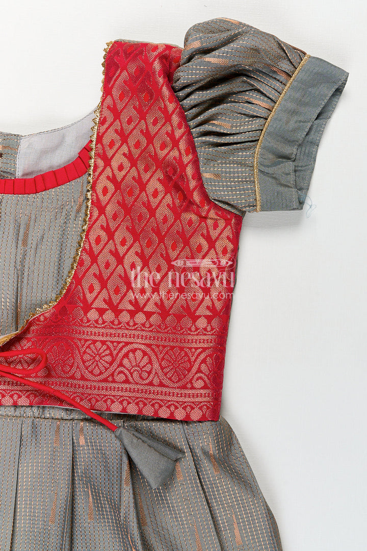 The Nesavu Girls Kanchi Silk Frock Girls Kanchivaram Long Pattu Frock with Puff Sleeves in Grey Silk and Rich Red Zari Border Finish Nesavu Nesavu Girls Long Pattu Frock Grey Kanchivaram Silk Red Zari Overlay Traditional Pleated Design