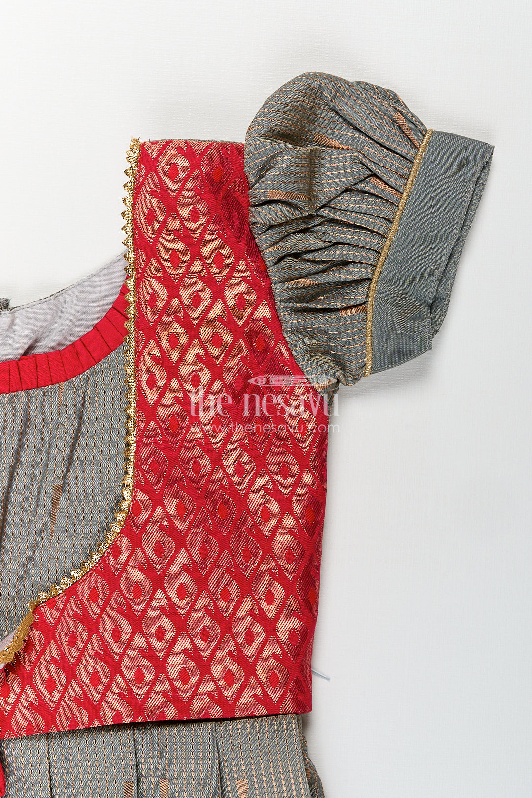 The Nesavu Girls Kanchi Silk Frock Girls Kanchivaram Long Pattu Frock with Puff Sleeves in Grey Silk and Rich Red Zari Border Finish Nesavu Nesavu Girls Long Pattu Frock Grey Kanchivaram Silk Red Zari Overlay Traditional Pleated Design