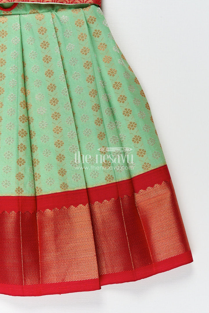 The Nesavu Girls Kanchi Silk Frock Girls Kanchivaram Pattu Saree Long Frock with Puff Sleeves in Green and Red Zari Woven Traditional Style Nesavu Nesavu Girls Pattu Saree Long Frock Kanchivaram Silk Green Body Red Zari Pleated Border