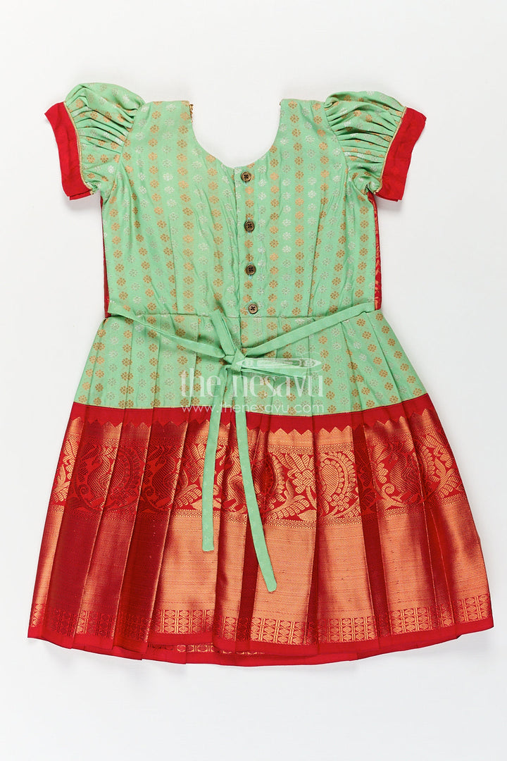 The Nesavu Girls Kanchi Silk Frock Girls Kanchivaram Pattu Saree Long Frock with Puff Sleeves in Green and Red Zari Woven Traditional Style Nesavu Nesavu Girls Pattu Saree Long Frock Kanchivaram Silk Green Body Red Zari Pleated Border