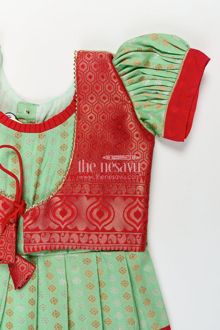 The Nesavu Girls Kanchi Silk Frock Girls Kanchivaram Pattu Saree Long Frock with Puff Sleeves in Green and Red Zari Woven Traditional Style Nesavu Nesavu Girls Pattu Saree Long Frock Kanchivaram Silk Green Body Red Zari Pleated Border