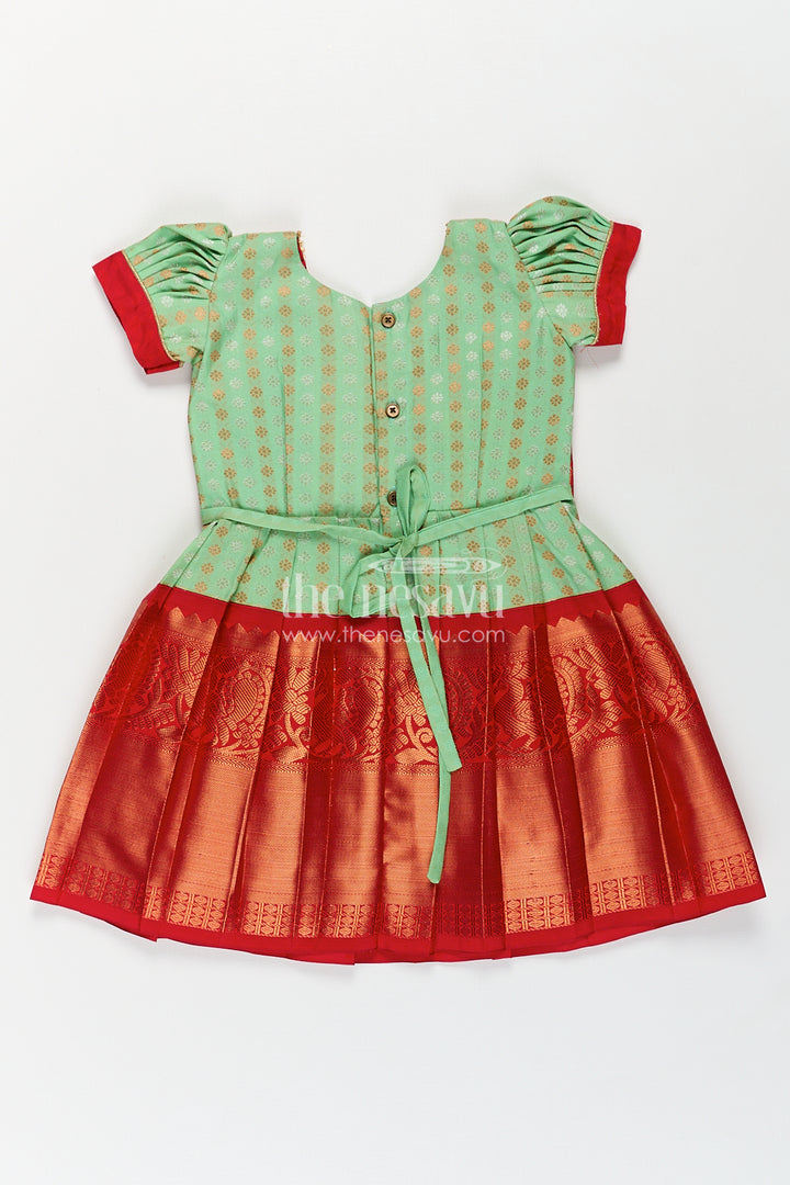 The Nesavu Girls Kanchi Silk Frock Girls Kanchivaram Pattu Saree Long Frock with Puff Sleeves in Green and Red Zari Woven Traditional Style Nesavu Nesavu Girls Pattu Saree Long Frock Kanchivaram Silk Green Body Red Zari Pleated Border