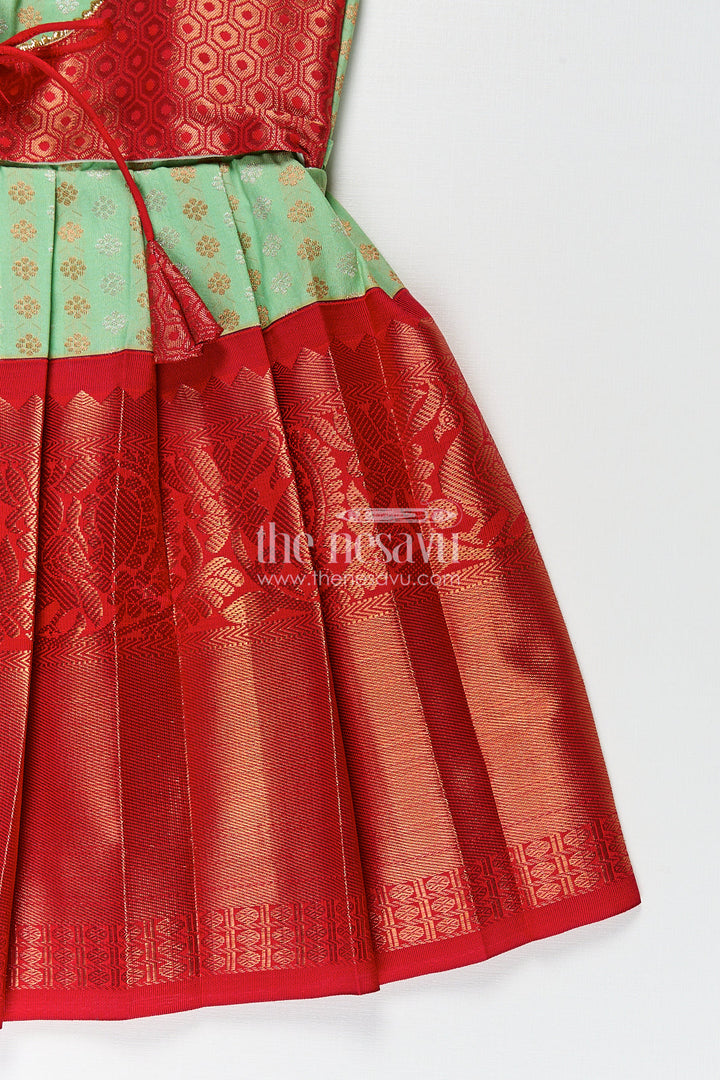 The Nesavu Girls Kanchi Silk Frock Girls Kanchivaram Pattu Saree Long Frock with Puff Sleeves in Green and Red Zari Woven Traditional Style Nesavu Nesavu Girls Pattu Saree Long Frock Kanchivaram Silk Green Body Red Zari Pleated Border