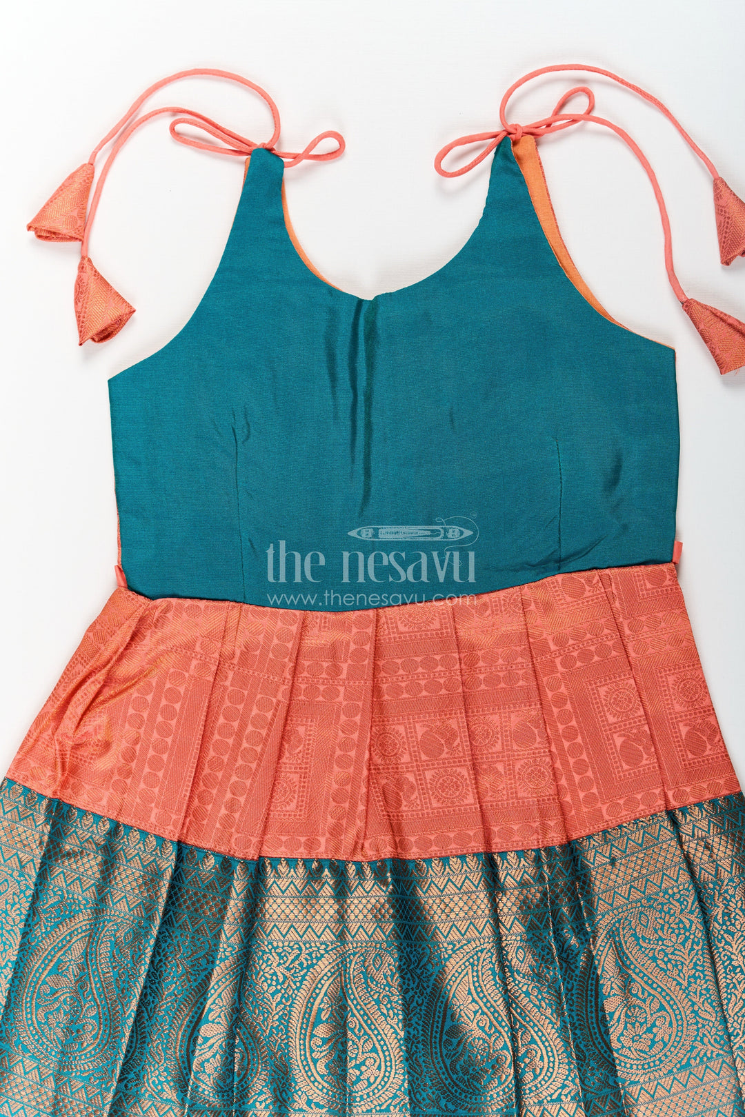 The Nesavu Tie-up Frock Girls Kanchivaram Silk Tie Up Frock in Orange and Teal with Traditional Zari Weave and Shoulder Tassels Nesavu Kanchivaram Silk Tie Up Frock for Girls in Orange and Teal with Traditional Zari Design | The Nesavu
