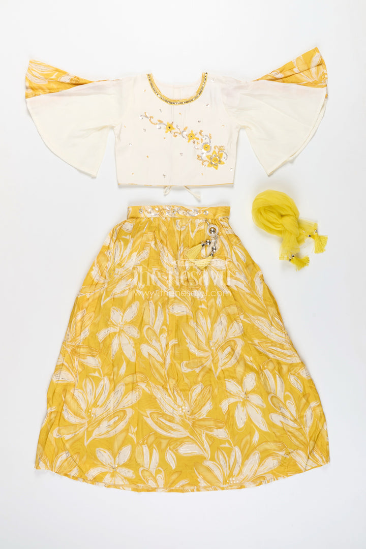 The Nesavu Girls Lehenga Choli Girls lehenga choli set with floral print and flutter sleeves Nesavu Nesavu yellow floral lehenga choli set girls flutter sleeves  festive haldi outfit