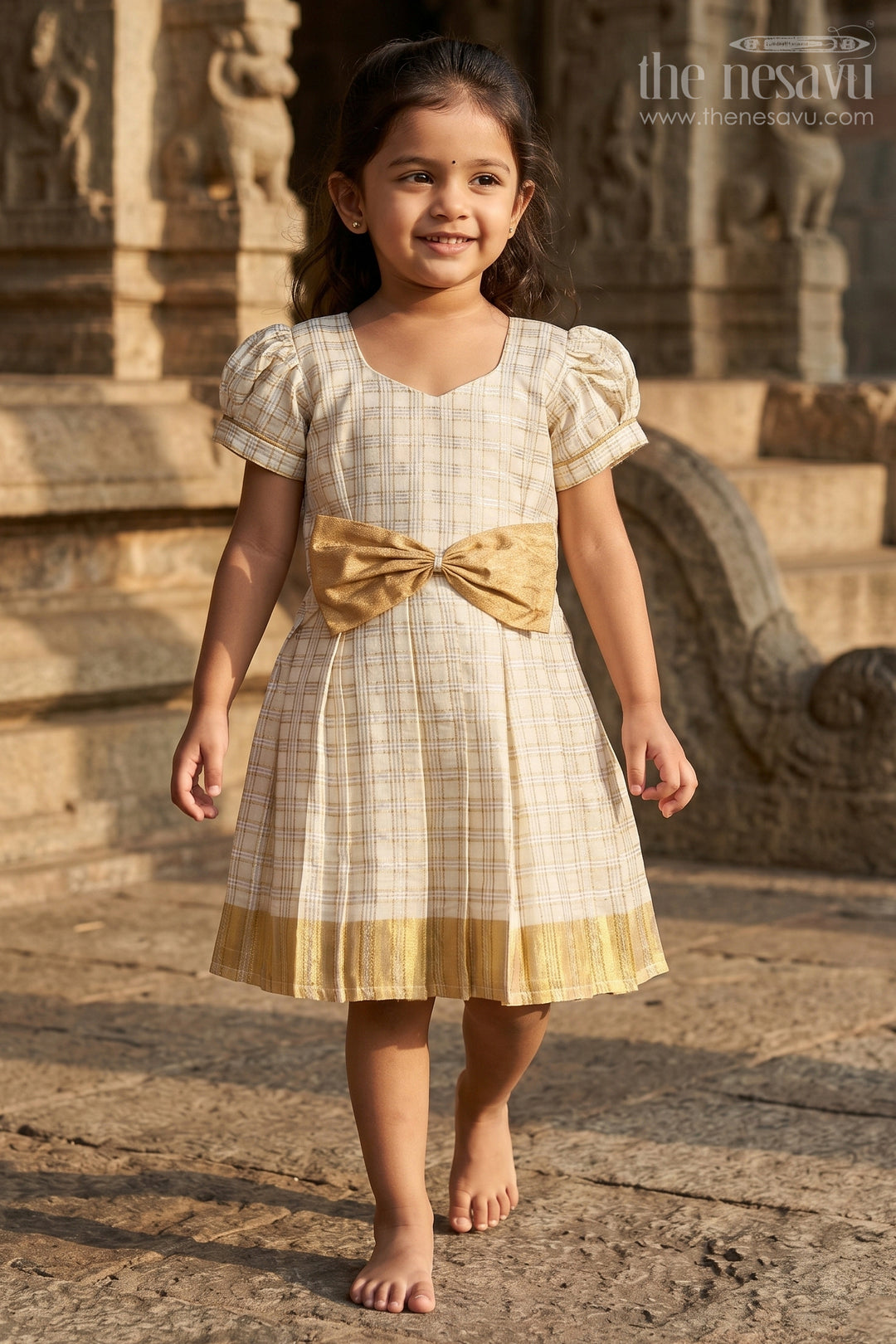The Nesavu Silk Frock Girls Long Frock Dress in Beige Silk with Bow Accent and Golden Checked Pattern Nesavu 16 (1Y) / Cream SF1010C-16 Nesavu Girls Long Frock Dress Checked Beige Silk Golden Bow Pleated Finish