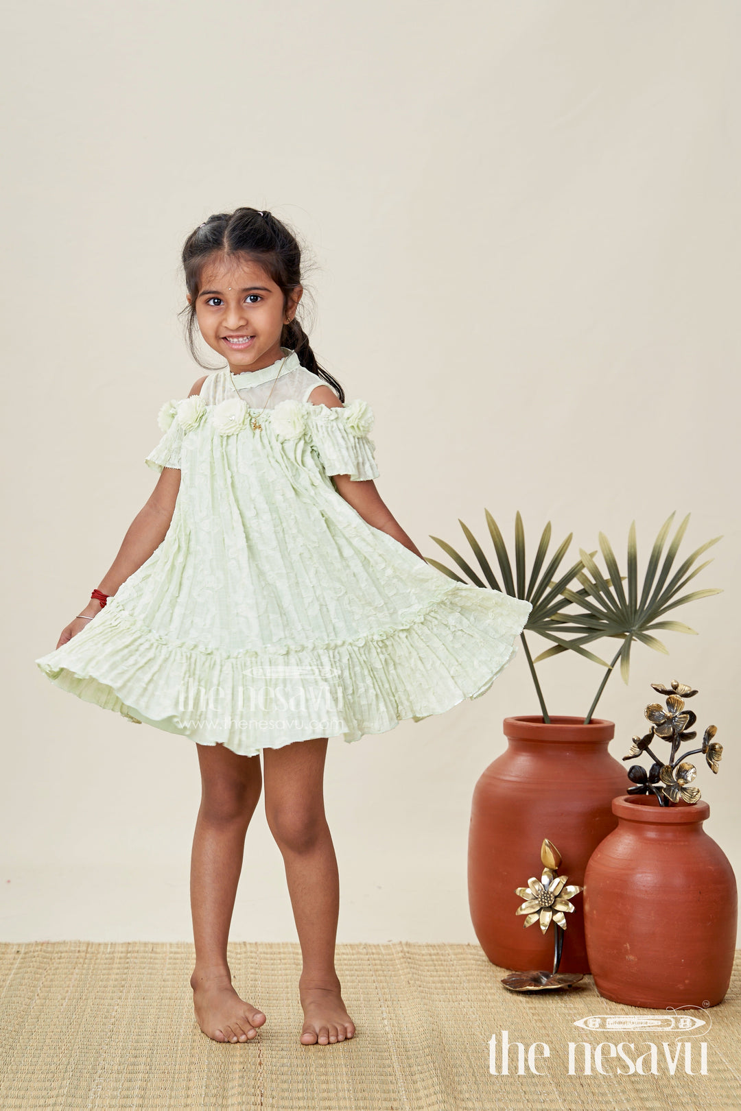 The Nesavu Girls Cotton Frock Girls Mini Organza Frock in Light Green with Crushed Texture and Floral Embellishments for Elegant Looks Nesavu 16 (1Y) / Green GFC1790A-16 Nesavu Girls Mini Organza Frock Light Green Crushed Texture Floral Puff Sleeve Design