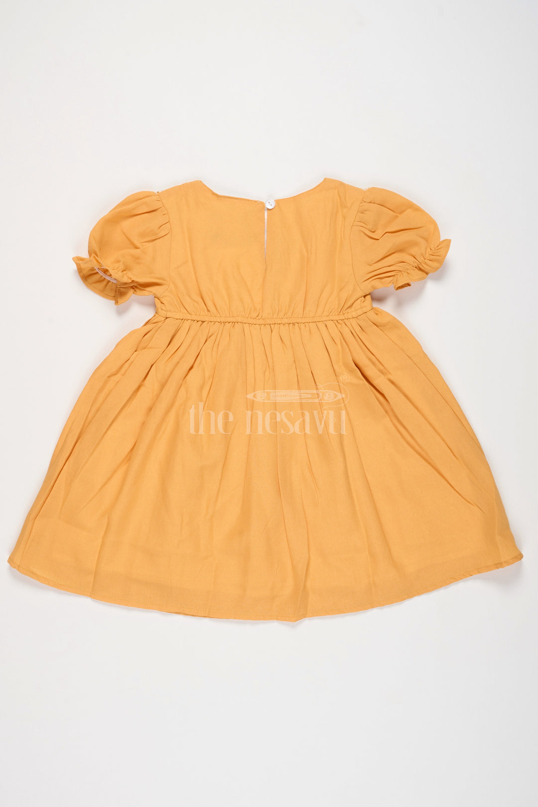 The Nesavu Girls Cotton Frock Girls Mustard Cotton Frock with Embroidered Yoke and Puff Sleeves in Simple Frock Design Cotton Look Nesavu Nesavu Girls Cotton Frock Mustard Embroidered Front Puff Sleeves frock design cotton