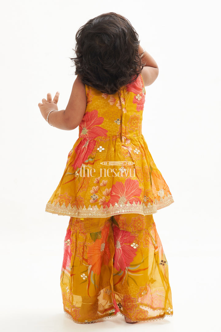 The Nesavu Girls Sharara / Plazo Set Girls' Mustard Yellow Floral Organza Garara Set with Embroidery and Samosa Lace Nesavu Mustard Yellow Floral Organza Garara Set with Embroidery for Girls