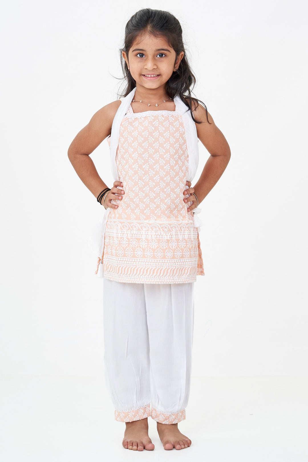 The Nesavu Girls Churidar Sets Girls Orange Chudi Set in Cotton with Embroidered Sleeveless Kurti and White Dhoti Pants Nesavu Girls Orange Chudi Set Thread Embroidery Cotton Kurti White Dhoti Dupatta | The Nesavu