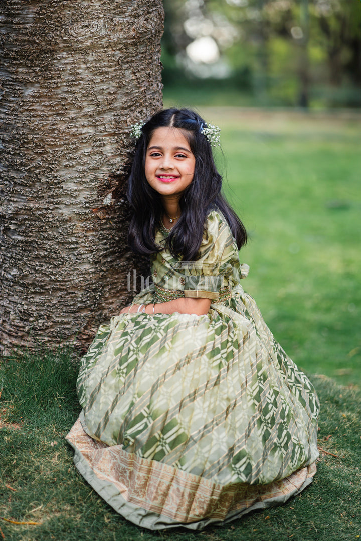 The Nesavu Girls Party Gown Girls Party Gown in Green Tissue Silk with Golden Floral Motifs and Pleated Full-Length Skirt Nesavu Nesavu Girls Party Gown Green Tissue Silk Floral Embellishments Pleated Skirt