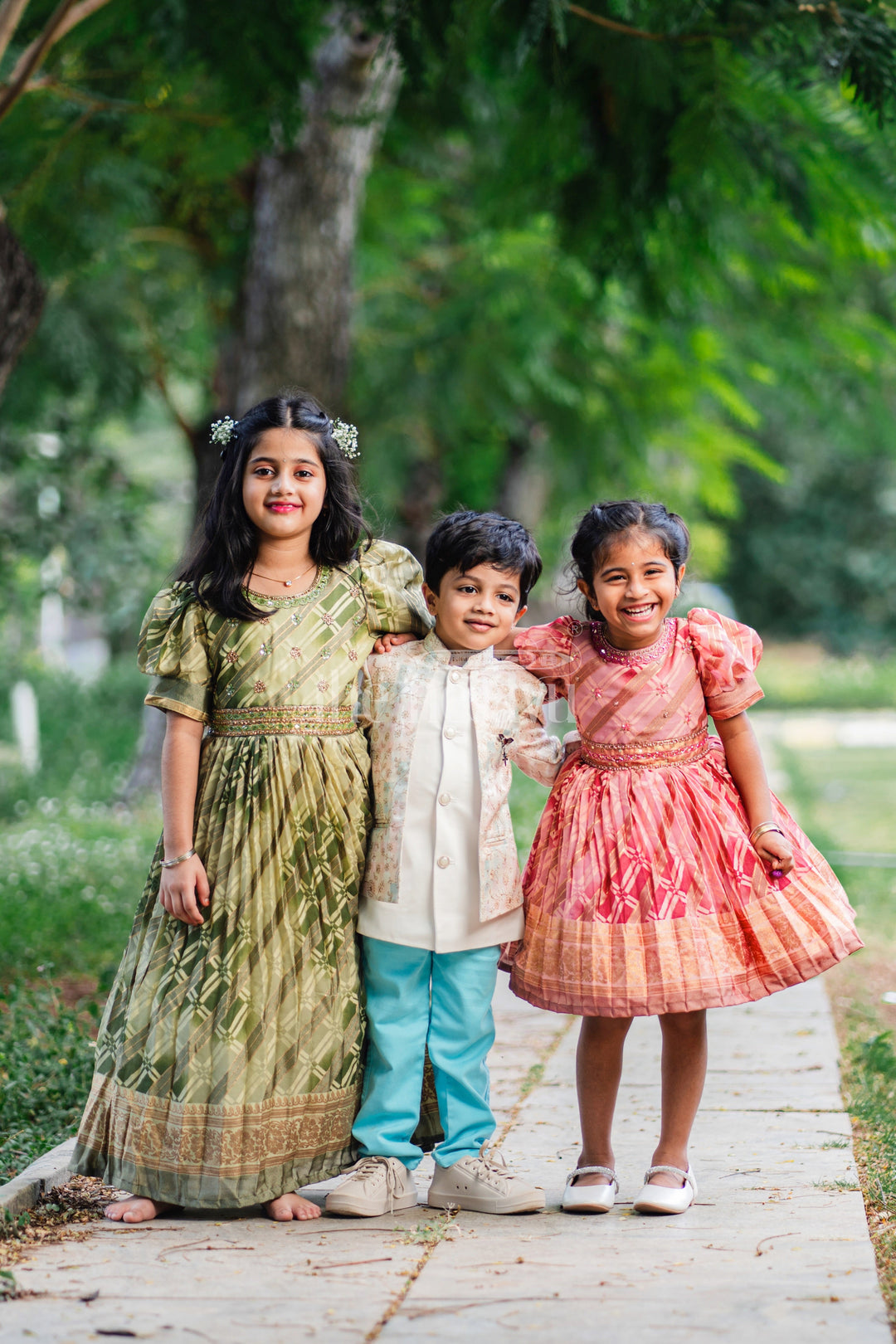 The Nesavu Girls Party Gown Girls Party Gown in Green Tissue Silk with Golden Floral Motifs and Pleated Full-Length Skirt Nesavu Nesavu Girls Party Gown Green Tissue Silk Floral Embellishments Pleated Skirt