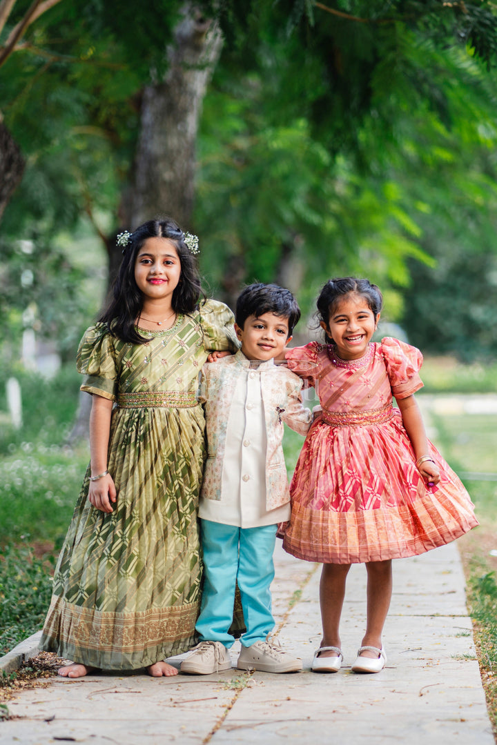 The Nesavu Girls Party Gown Girls Party Gown in Green Tissue Silk with Golden Floral Motifs and Pleated Full-Length Skirt Nesavu Nesavu Girls Party Gown Green Tissue Silk Floral Embellishments Pleated Skirt