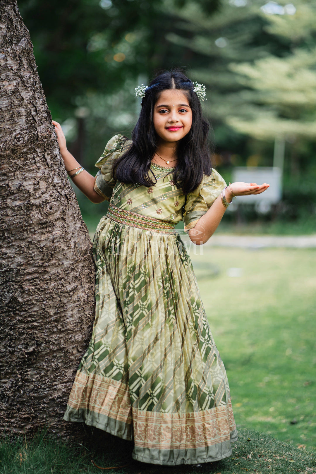 The Nesavu Girls Party Gown Girls Party Gown in Green Tissue Silk with Golden Floral Motifs and Pleated Full-Length Skirt Nesavu Nesavu Girls Party Gown Green Tissue Silk Floral Embellishments Pleated Skirt