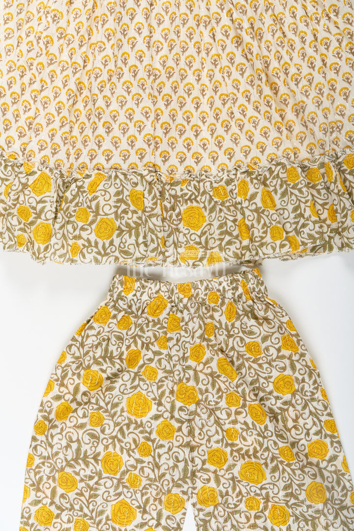 The Nesavu Girls Sharara / Plazo Set Girls Partywear Sharara Set in Yellow Floral Cotton with Mirror and Thread Embroidery Accents Nesavu Girls Partywear Sharara Set with Mirror Embroidery and Yellow Floral Printed Cotton Co-Ord Look | The Nesavu