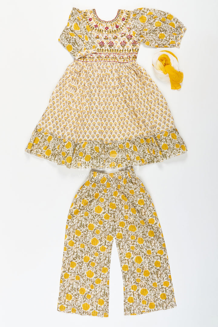 The Nesavu Girls Sharara / Plazo Set Girls Partywear Sharara Set in Yellow Floral Cotton with Mirror and Thread Embroidery Accents Nesavu Girls Partywear Sharara Set with Mirror Embroidery and Yellow Floral Printed Cotton Co-Ord Look | The Nesavu
