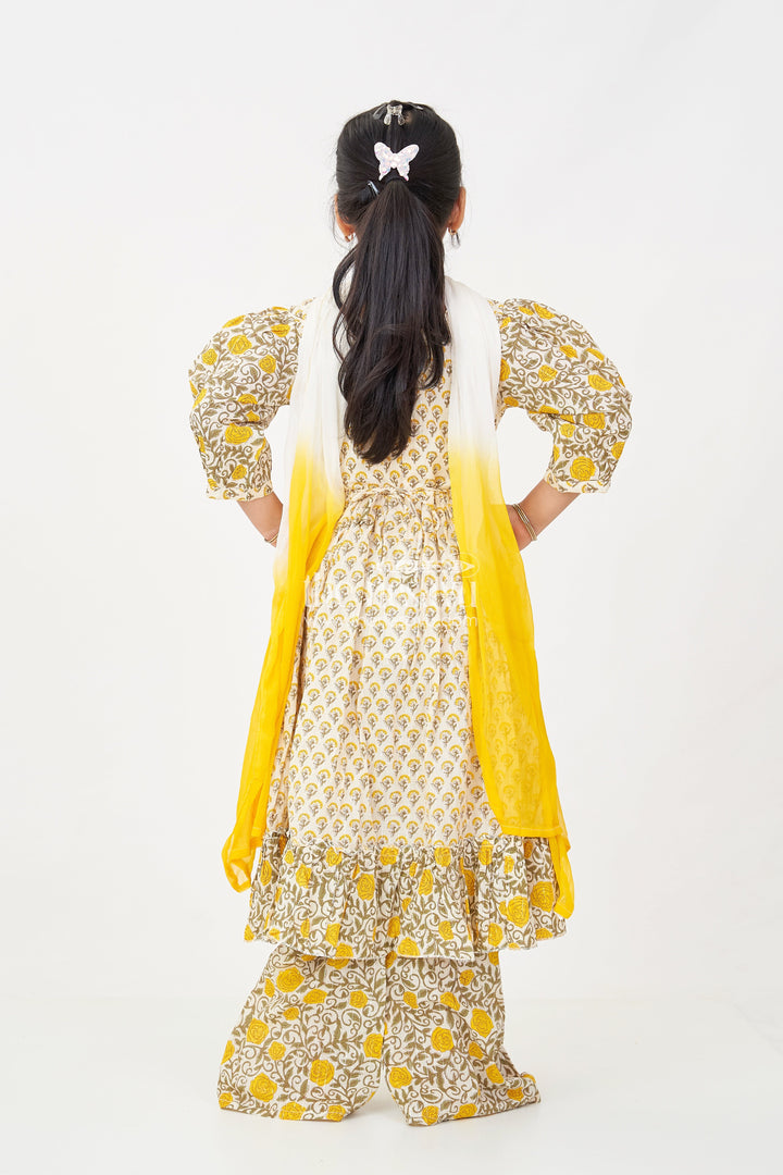 The Nesavu Girls Sharara / Plazo Set Girls Partywear Sharara Set in Yellow Floral Cotton with Mirror and Thread Embroidery Accents Nesavu Girls Partywear Sharara Set with Mirror Embroidery and Yellow Floral Printed Cotton Co-Ord Look | The Nesavu
