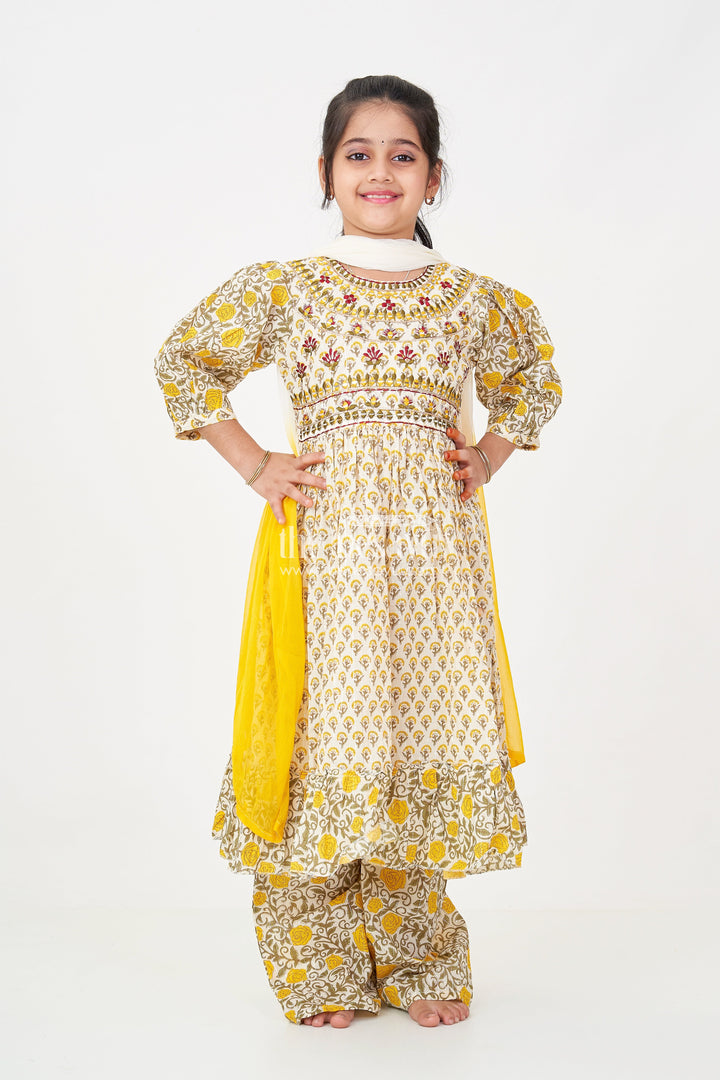 The Nesavu Girls Sharara / Plazo Set Girls Partywear Sharara Set in Yellow Floral Cotton with Mirror and Thread Embroidery Accents Nesavu Girls Partywear Sharara Set with Mirror Embroidery and Yellow Floral Printed Cotton Co-Ord Look | The Nesavu