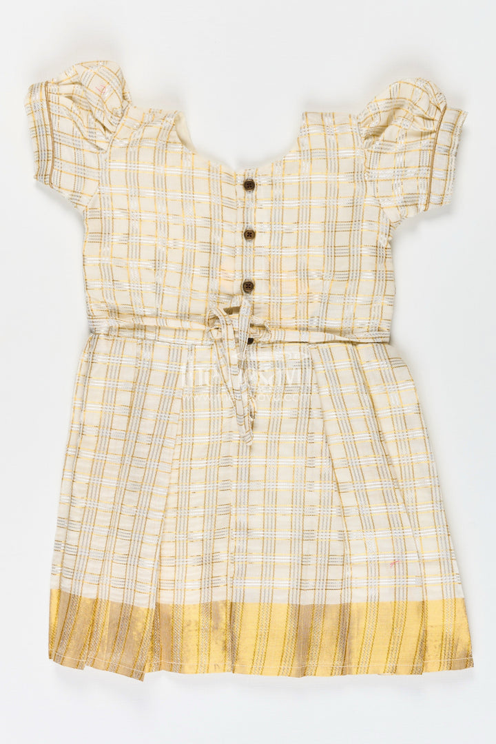 The Nesavu Silk Frock Girls Pattu Frock in Beige Tissue with Gold Bow and Checked Design for Festive Elegance Nesavu Nesavu Girls Pattu Frock Beige Silk Gold Checked Weave Bow Embellishment