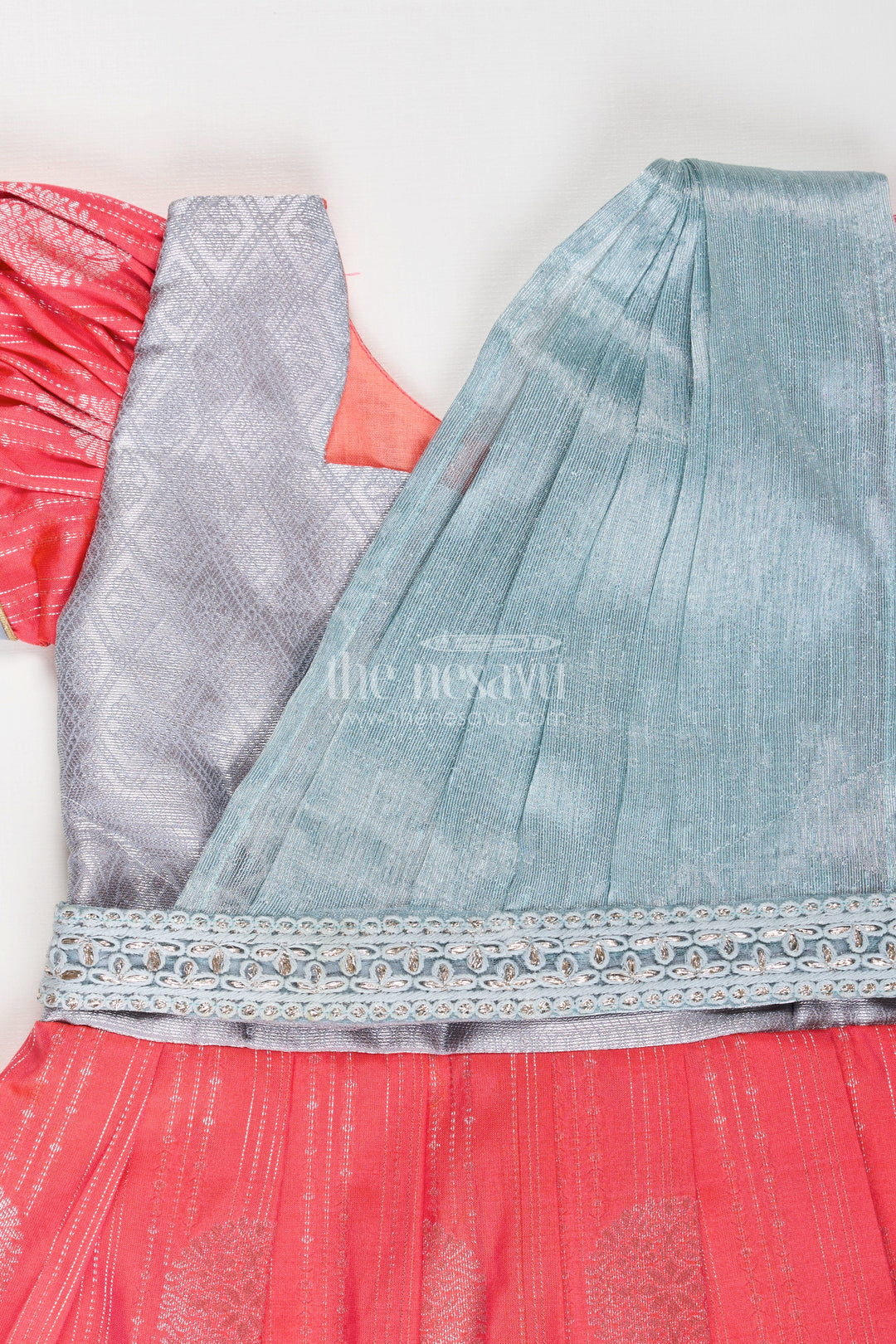 The Nesavu Girls Kanchi Silk Frock Girls Pattu Frock Model in Blue Semi Kanchivaram Silk with Red Accents and Lace Embellished Dupatta Nesavu Nesavu Girls Pattu Frock Model in Blue Semi Kanchivaram Silk with Red Accents and Embroidered Dupatta