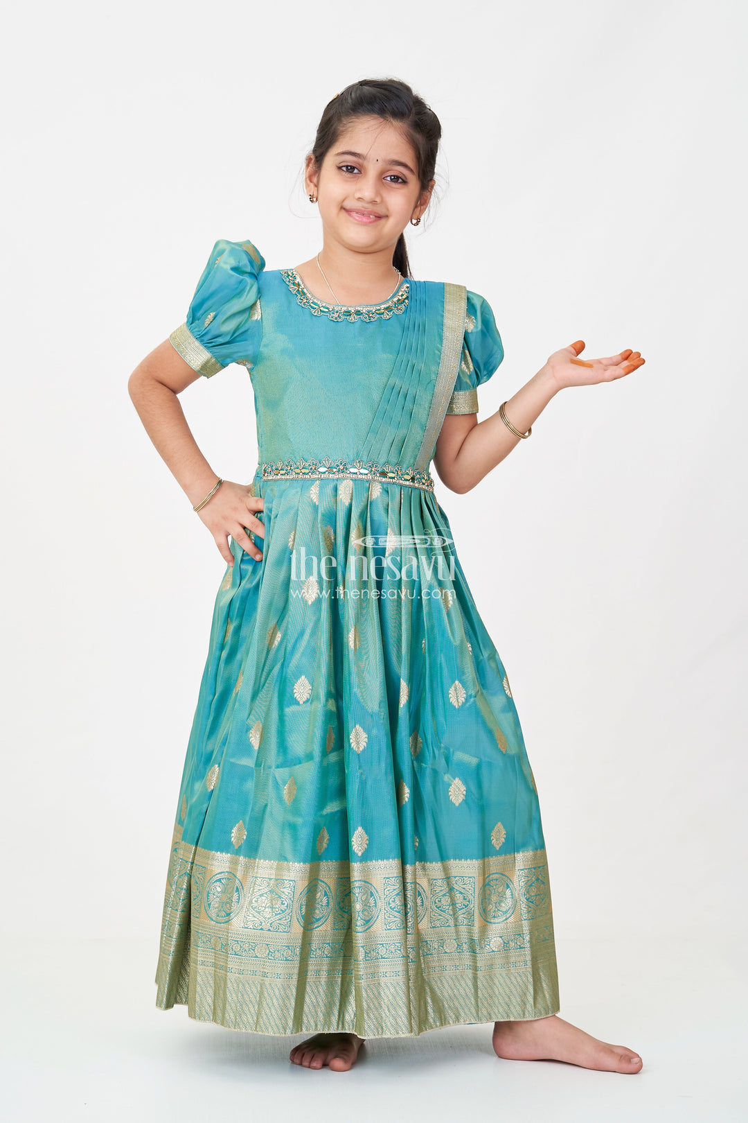 The Nesavu Girls Silk Gown Girls Pattu Gown in Banarasi Silk Blend Jacquard with Zari Big Border and Puff Sleeves for Festive Flair Nesavu 24 (5Y) / Green GA312A-24 Nesavu Traditional Girls Pattu Gown in Banarasi Silk Blend Jacquard with Zari Border and Puff Sleeves