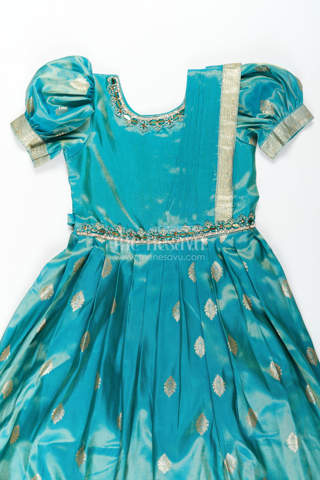 The Nesavu Girls Silk Gown Girls Pattu Gown in Banarasi Silk Blend Jacquard with Zari Big Border and Puff Sleeves for Festive Flair Nesavu Nesavu Traditional Girls Pattu Gown in Banarasi Silk Blend Jacquard with Zari Border and Puff Sleeves