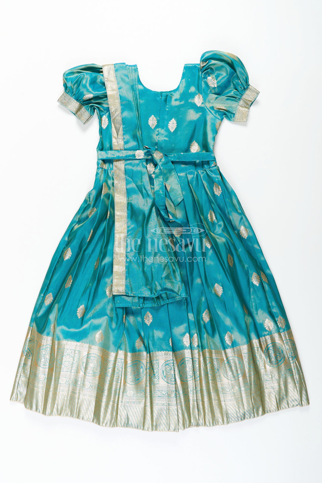 The Nesavu Girls Silk Gown Girls Pattu Gown in Banarasi Silk Blend Jacquard with Zari Big Border and Puff Sleeves for Festive Flair Nesavu Traditional Girls Pattu Gown in Banarasi Silk Blend Jacquard with Zari Border and Puff Sleeves | The Nesavu