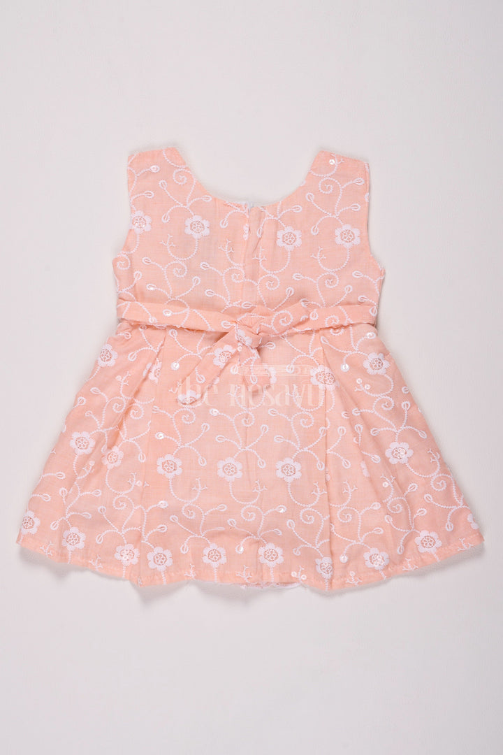 The Nesavu Baby Cotton Frocks Girls Peach Cotton Embroidered Frock with Floral Design and Bow Detail for Celebrations Nesavu Nesavu Girls Peach Cotton Frock Floral Embroidery Bow Special Celebrations