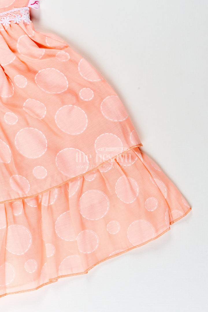 The Nesavu Girls Fancy Frock Girls peach georgette frock with polka dots for birthday and festive wear Nesavu Nesavu girls peach georgette frock polka dots birthdays festive occasions