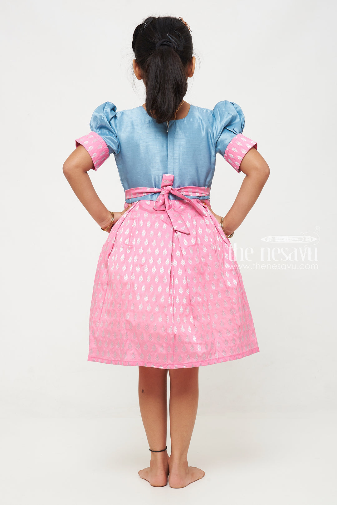 The Nesavu Silk Frock Girls Pink and Blue Silk Frock with Banarasi Motifs and Puff Sleeves in Traditional Silky Frock Appeal Nesavu Nesavu Girls Silk Frock Banarasi Pink Blue Embroidered Neckline silky frock