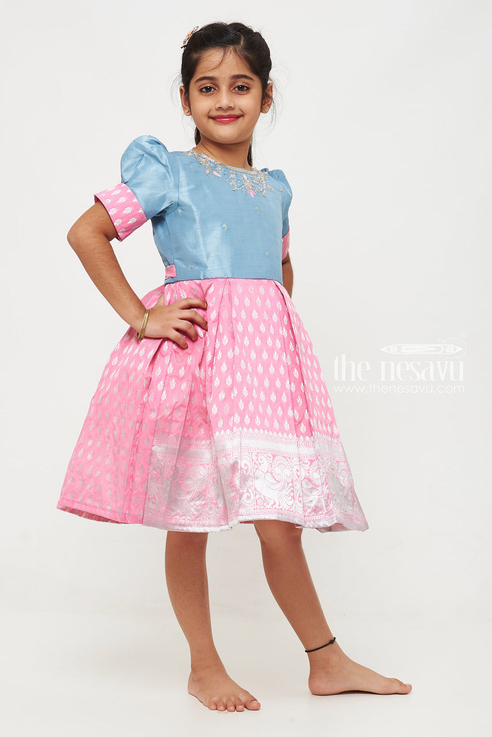 The Nesavu Silk Frock Girls Pink and Blue Silk Frock with Banarasi Motifs and Puff Sleeves in Traditional Silky Frock Appeal Nesavu Nesavu Girls Silk Frock Banarasi Pink Blue Embroidered Neckline silky frock