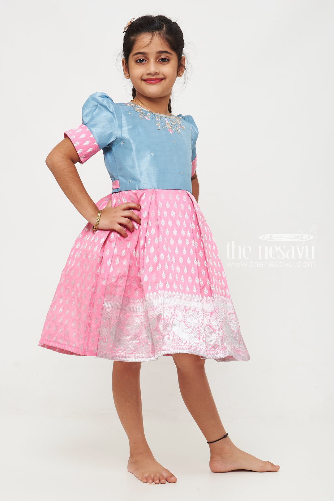 The Nesavu Silk Frock Girls Pink and Blue Silk Frock with Banarasi Motifs and Puff Sleeves in Traditional Silky Frock Appeal Nesavu Nesavu Girls Silk Frock Banarasi Pink Blue Embroidered Neckline silky frock