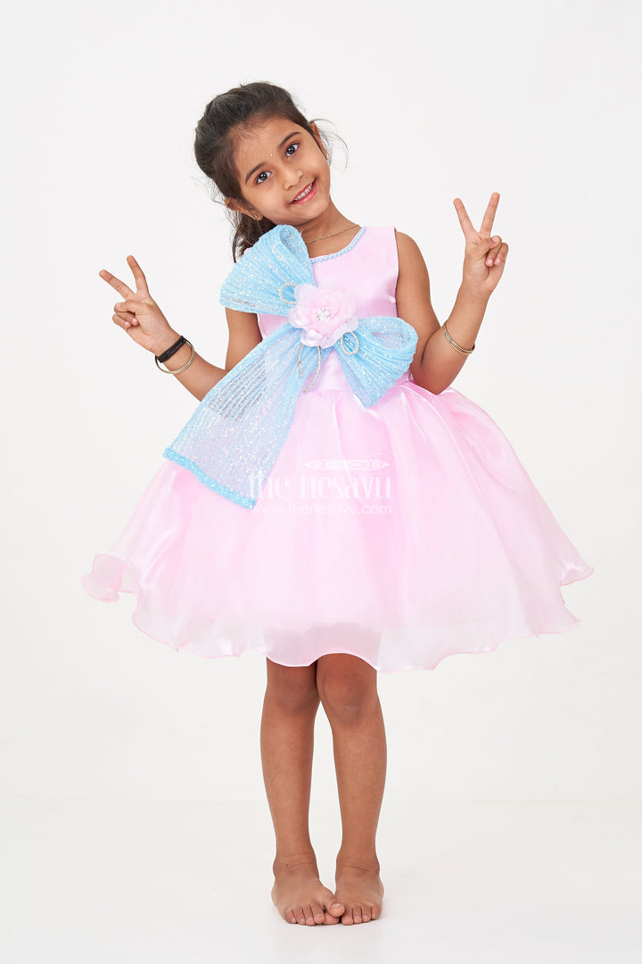 The Nesavu Girls Fancy Party Frock Girls Pink Net Frock with Blue Glitter Bow and Floral Accent in Glazed Organza Fabric Nesavu 16 (1Y) / Pink PF209B-16 Girls Pink Net Frock Blue Glitter Bow Glazed Organza Party Wear | The Nesavu