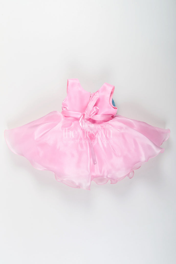 The Nesavu Girls Fancy Party Frock Girls Pink Net Frock with Blue Glitter Bow and Floral Accent in Glazed Organza Fabric Nesavu Girls Pink Net Frock Blue Glitter Bow Glazed Organza Party Wear | The Nesavu