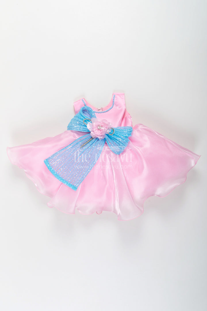 The Nesavu Girls Fancy Party Frock Girls Pink Net Frock with Blue Glitter Bow and Floral Accent in Glazed Organza Fabric Nesavu Girls Pink Net Frock Blue Glitter Bow Glazed Organza Party Wear | The Nesavu