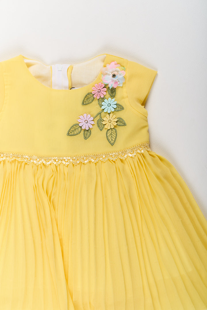 The Nesavu Girls Fancy Party Frock Girls Poly Georgette Frock in Sunshine Yellow with Floral Embellishments and Pleats Nesavu Girls Poly Georgette Frock Sunshine Yellow Floral Appliqu Weddings | The Nesavu