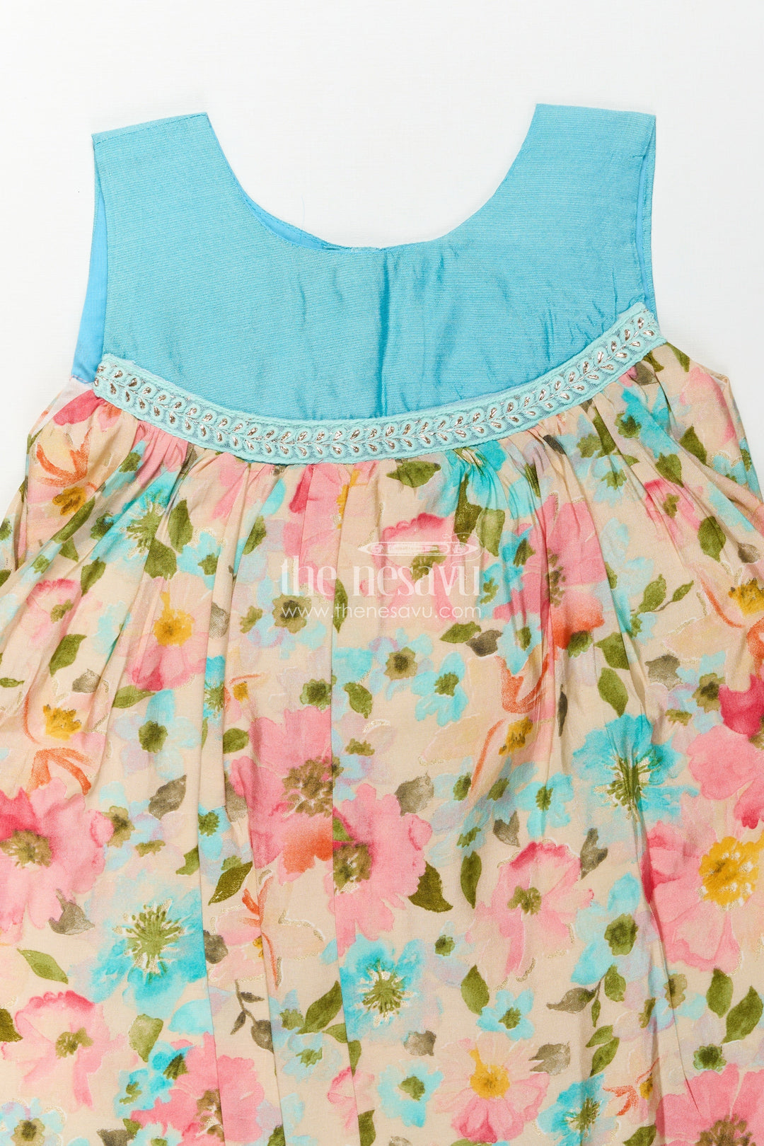 The Nesavu Girls Chanderi Frock Girls Printed Viscose Frock with Bright Floral Motifs and Blue Yoke in Long Frock for Party Wear Style Nesavu Girls Long Frock Party Wear Floral Printed Viscose Blue Embroidered Yoke Flowy Fit | The Nesavu