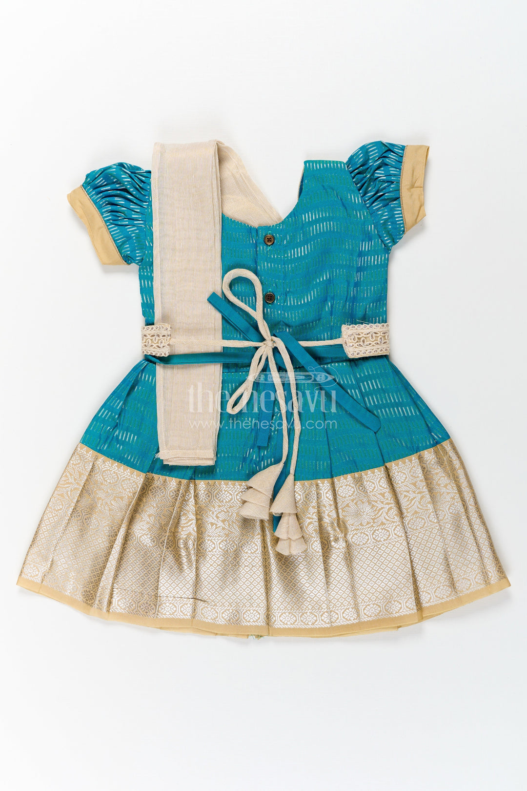 The Nesavu Girls Kanchi Silk Frock Girls Pure Silk Dress in Semi Kanchivaram with Teal and Beige Weaves and Elegant Embroidered Lace Dupatta Nesavu Girls Pure Silk Dress in Semi Kanchivaram with Teal Zari Skirt and Embroidered Lace Dupatta Accent | The Nesavu
