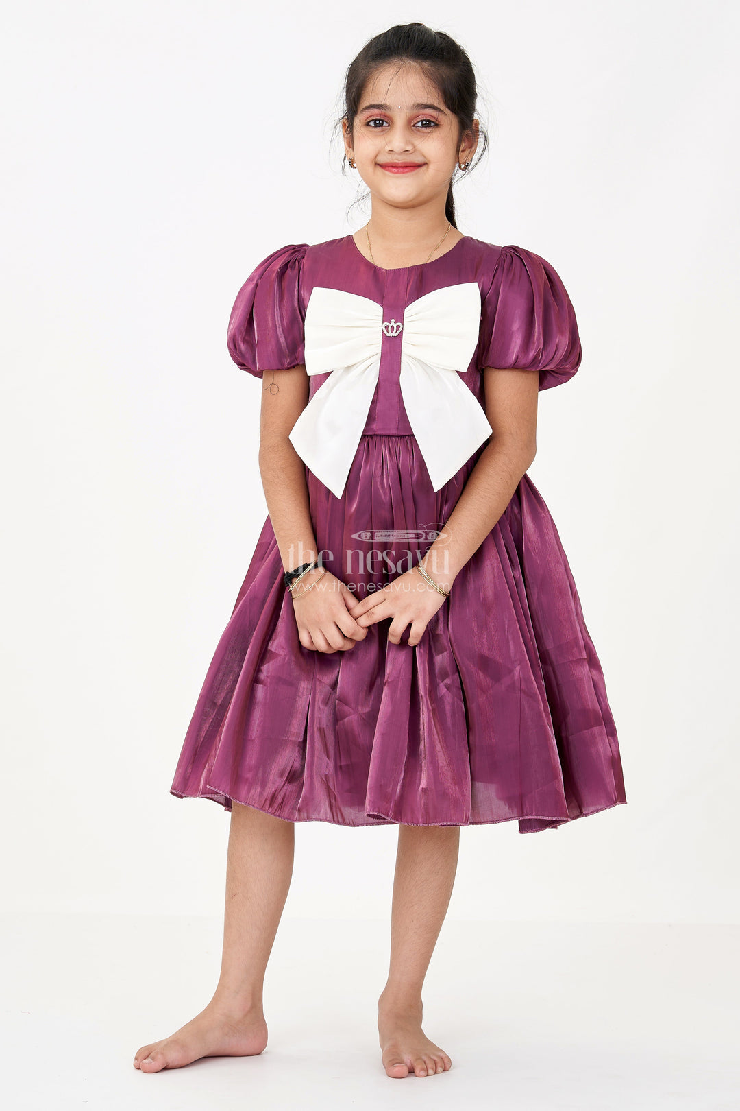 The Nesavu Girls Fancy Frock Girls Purple Frock Dress in Glossy Satin with Ivory Bow and Crown Brooch for Party Elegance Nesavu 20 (3Y) / Purple GFC1670B-20 Girls Purple Frock Dress Satin Ivory Bow Crown Brooch Detail | The Nesavu