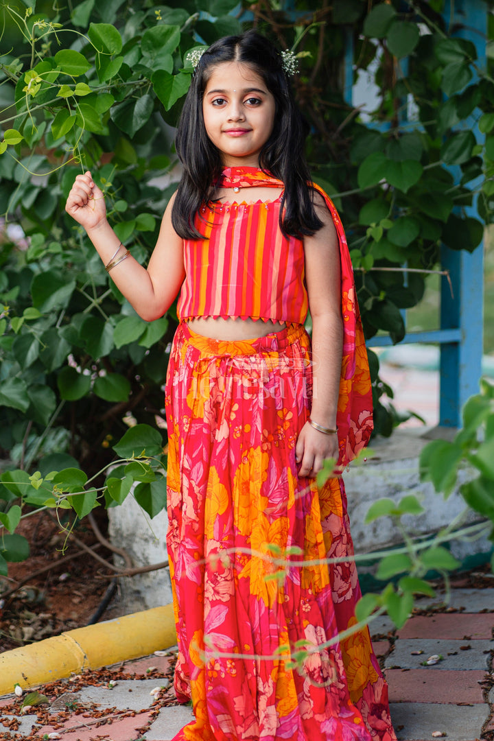 The Nesavu Girls Lehenga Choli Girls Red and Orange Lehenga Choli with Bold Floral Print and Striped Choli Top Nesavu Nesavu Girls Red Orange Floral Lehenga Choli Striped Choli Top Dupatta